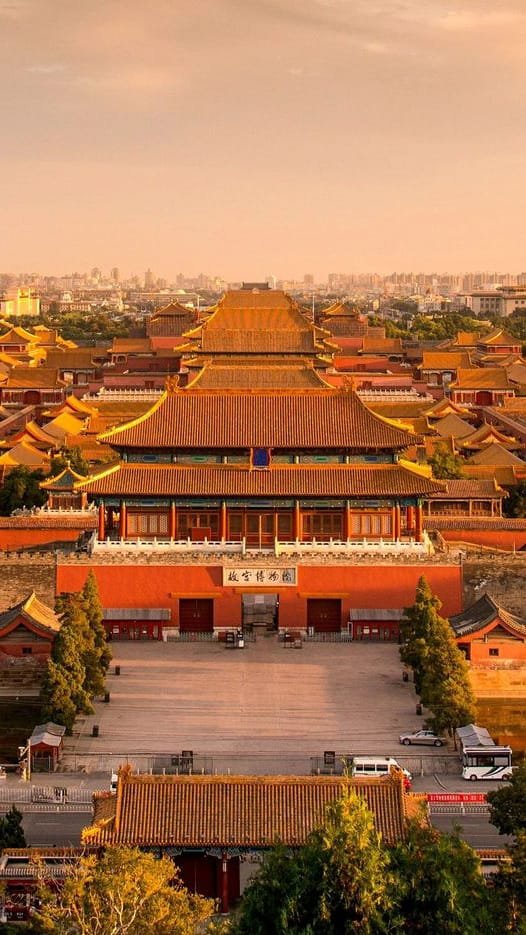a large asian building with a large courtyard with Forbidden City in the background in Bei Jing China