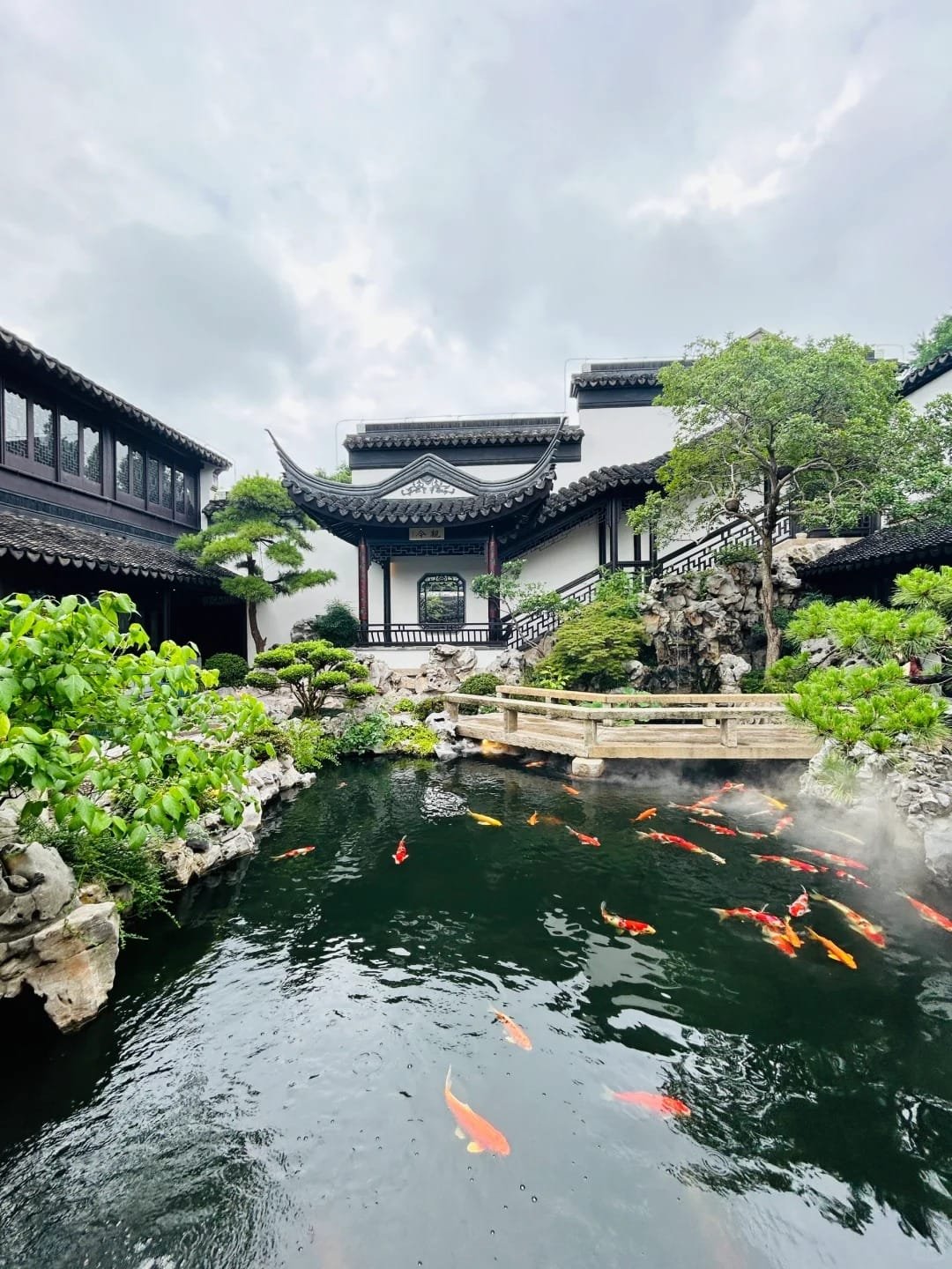 a building with a pond and trees in Su Zhou China